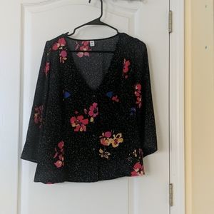 Patterned blouse button up front.